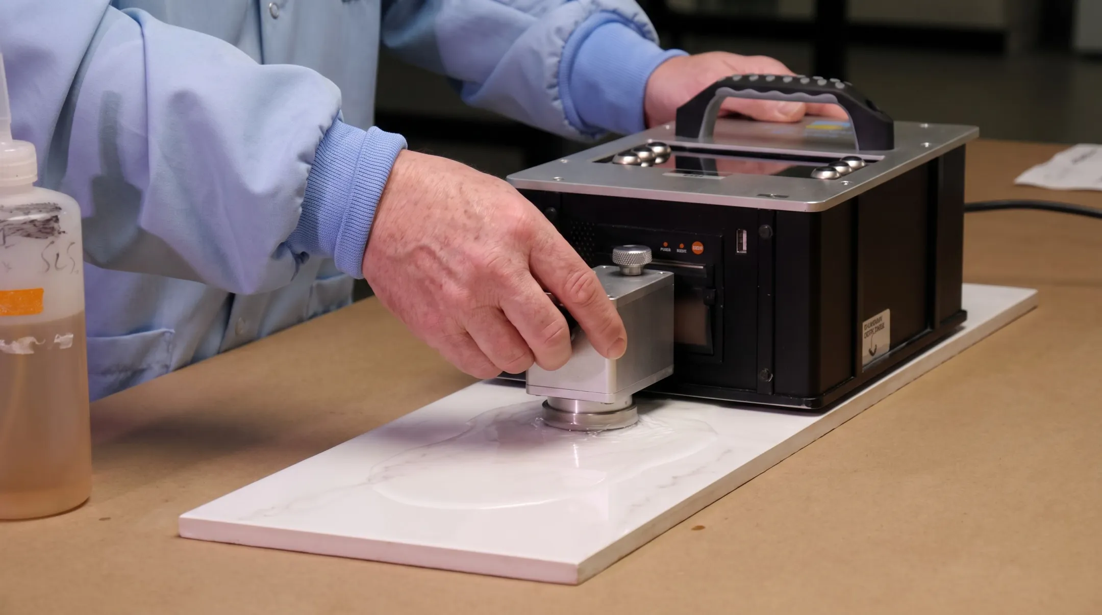 Tribometer device testing wet tile surface slip resistance in lab