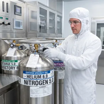 Technician preparing certified gas standards