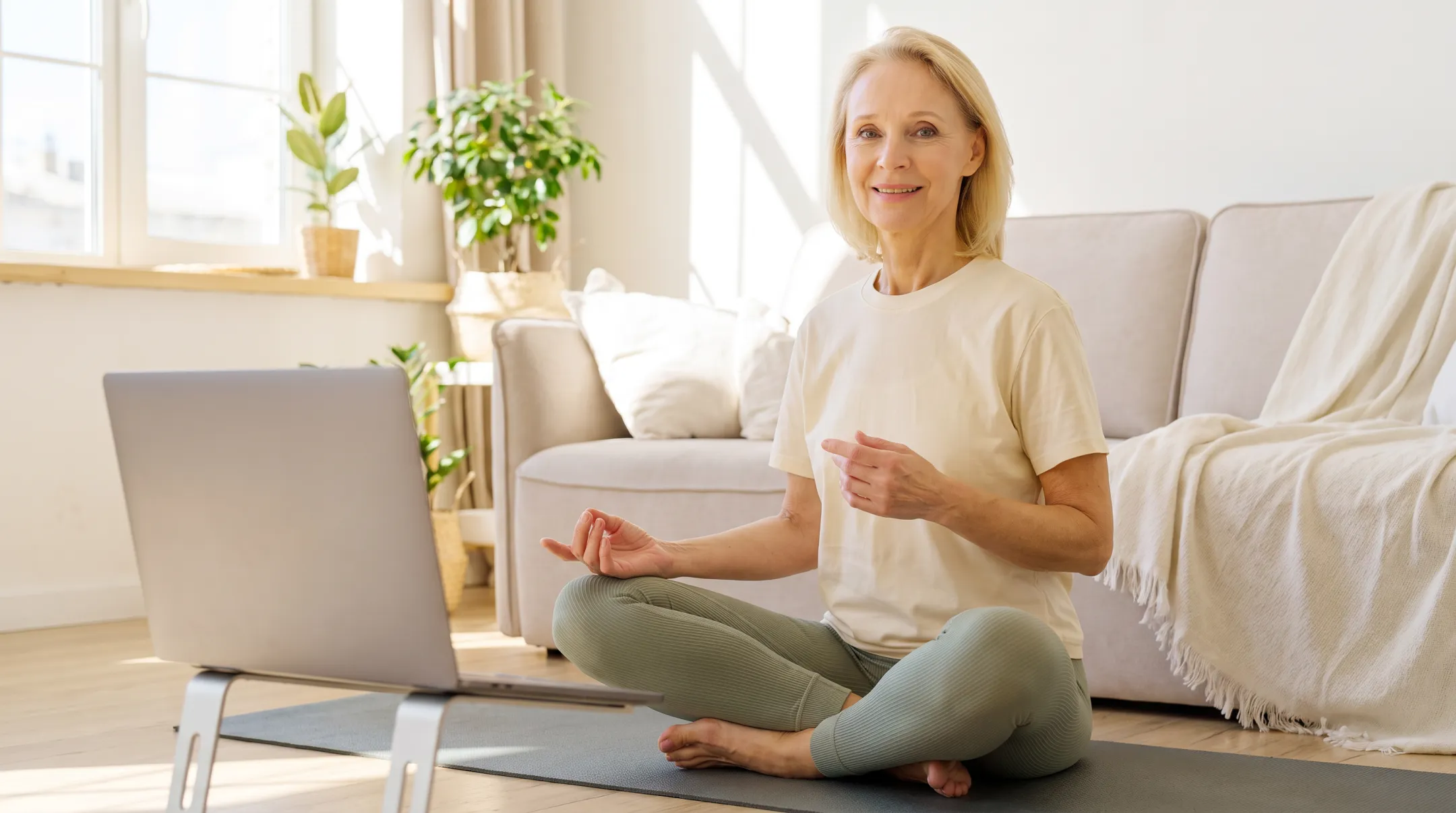 Yoga instructor leading online mindful movement and meditation class