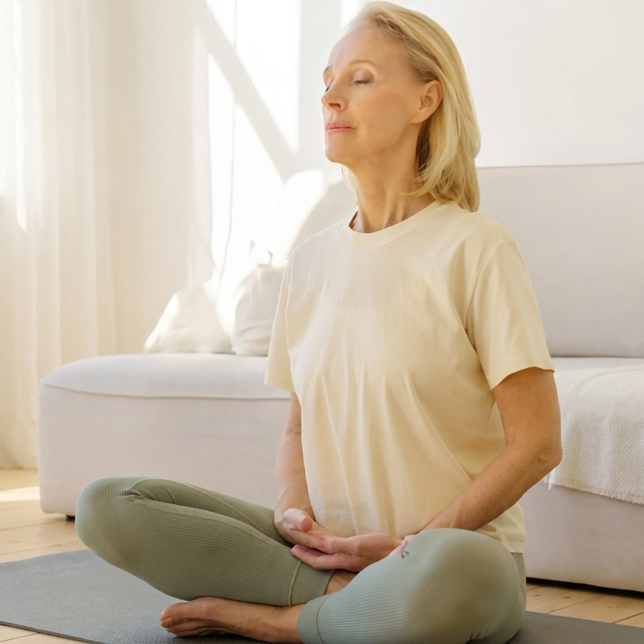 Woman practicing seated breath meditation at home