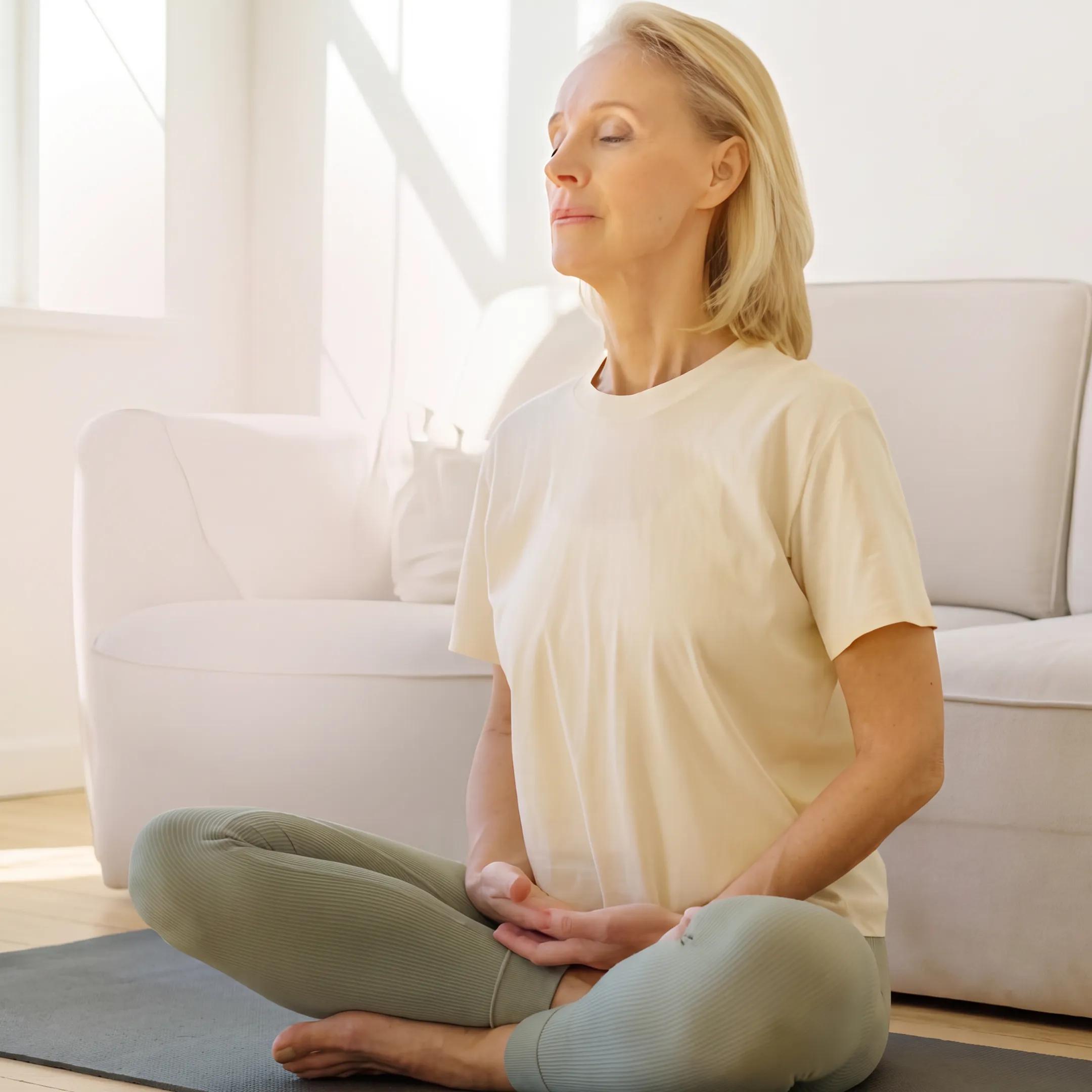 Woman meditating peacefully at home
