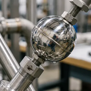 Stainless steel float ball in an industrial valve system