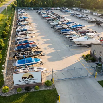 Boats stored securely in a fenced facility with easy drive-up access
