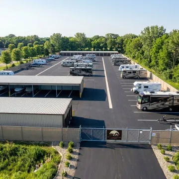 Secure RV storage facility with indoor and outdoor storage options near Eyota, Minnesota