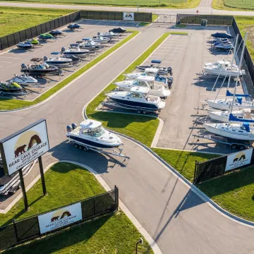 Boats safely stored in secure fenced facility with drive-up access
