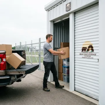 Customer unloading into a drive-up storage unit