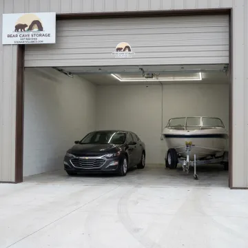 Boat and car stored in a secure enclosed storage unit