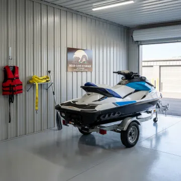 Indoor storage unit for jet ski and trailer