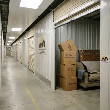 Climate controlled seasonal storage unit with boxes