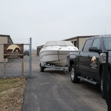 Boat trailer entering a secure gated storage facility