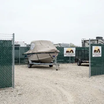 Boat and trailer stored at a secure outdoor storage facility