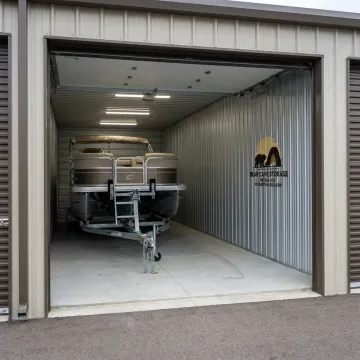 Stored boat in enclosed indoor storage