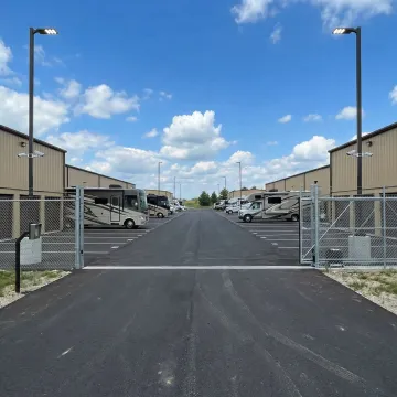 Large RV storage space with wide access lanes and security fencing