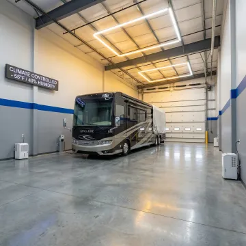 Protected RV parked in covered storage facility during winter
