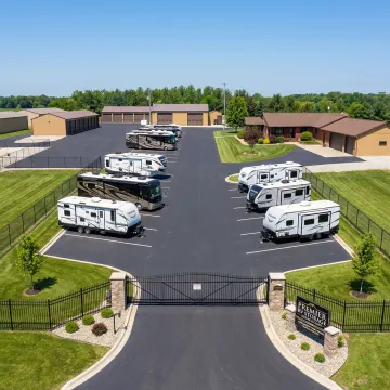 Secure RV storage facility with multiple recreational vehicles parked in protected outdoor spaces