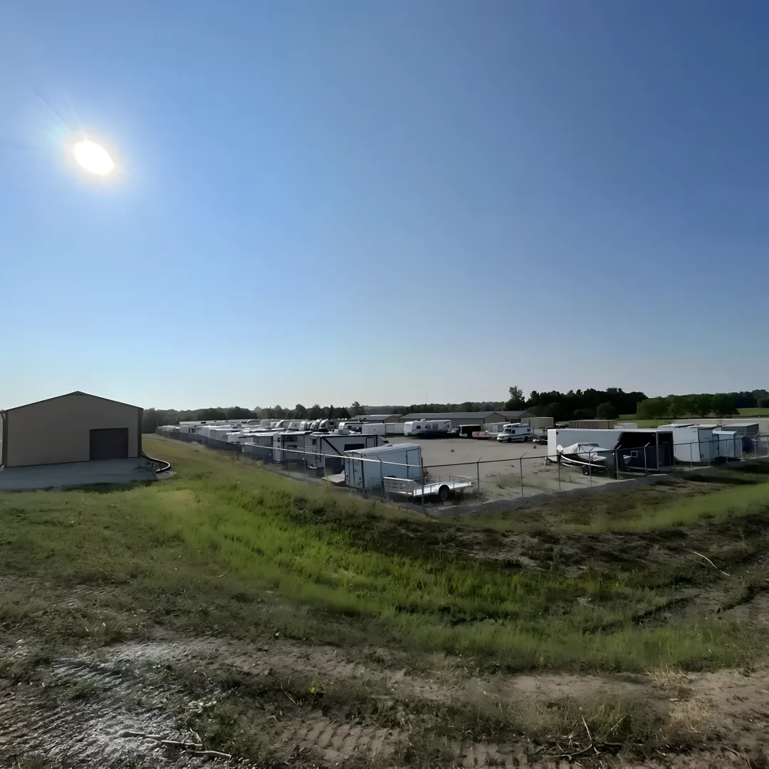 Secure RV storage facility with multiple recreational vehicles parked in designated outdoor spaces