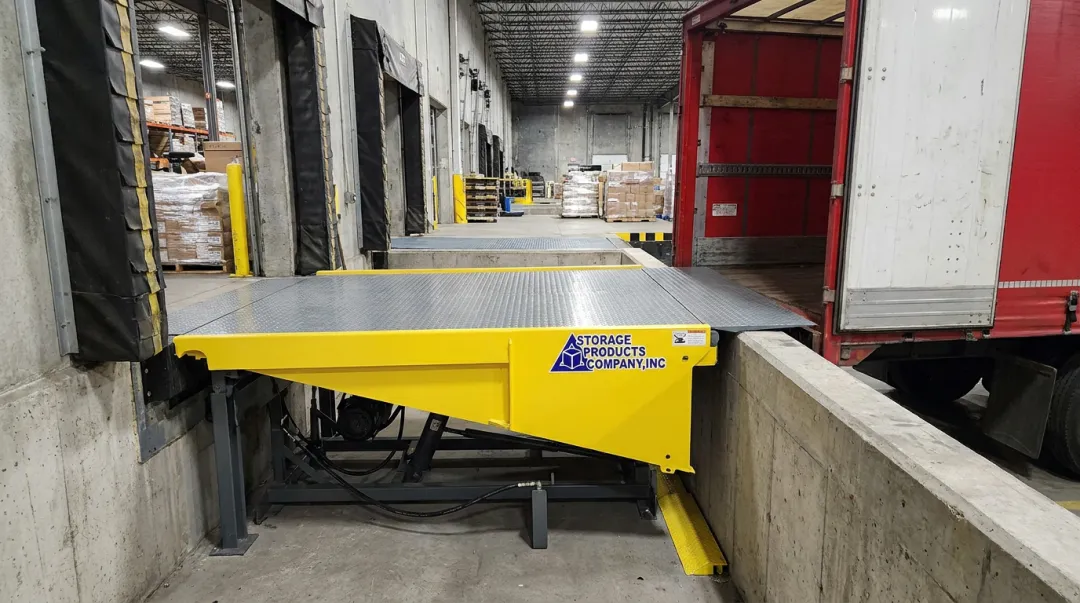 Hydraulic pit dock leveler installed at loading dock with push-button controls