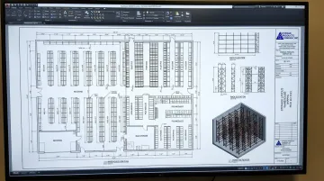 AutoCAD warehouse layout plan showing rack elevations aisle configurations and storage zones