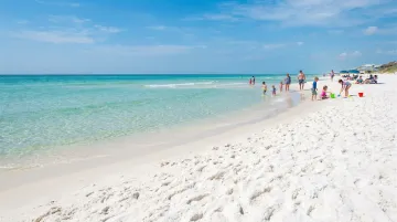 Emerald Coast Florida white quartz sand beach with calm turquoise Gulf water