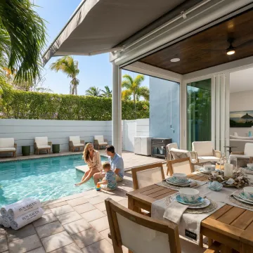 Family enjoying a luxury coastal vacation home pool