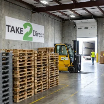 Recycled pallets stacked in a Dallas warehouse