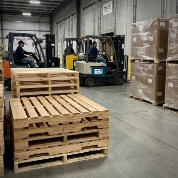 Custom wood pallets stacked in a warehouse