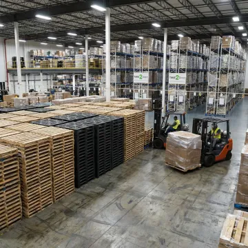 Custom pallets stacked in a Charlotte warehouse