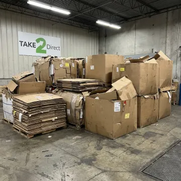Stacked gaylord boxes ready for recycling pickup