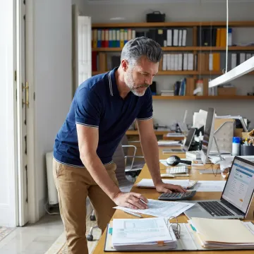 Tax advisor reviewing income tax documents