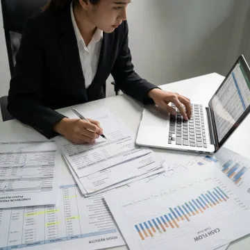 Accountant reviewing construction financial reports