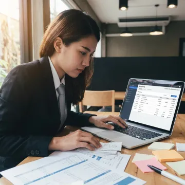 Outsourced bookkeeping professional working on financial reports
