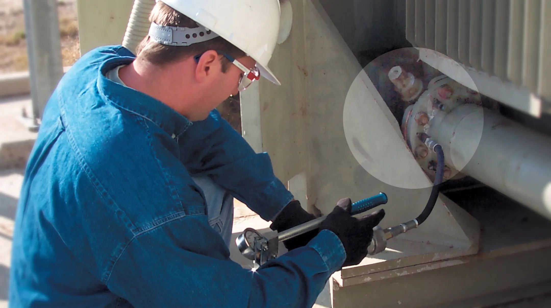 TDS technicians performing substation leak sealing near transformer bushings