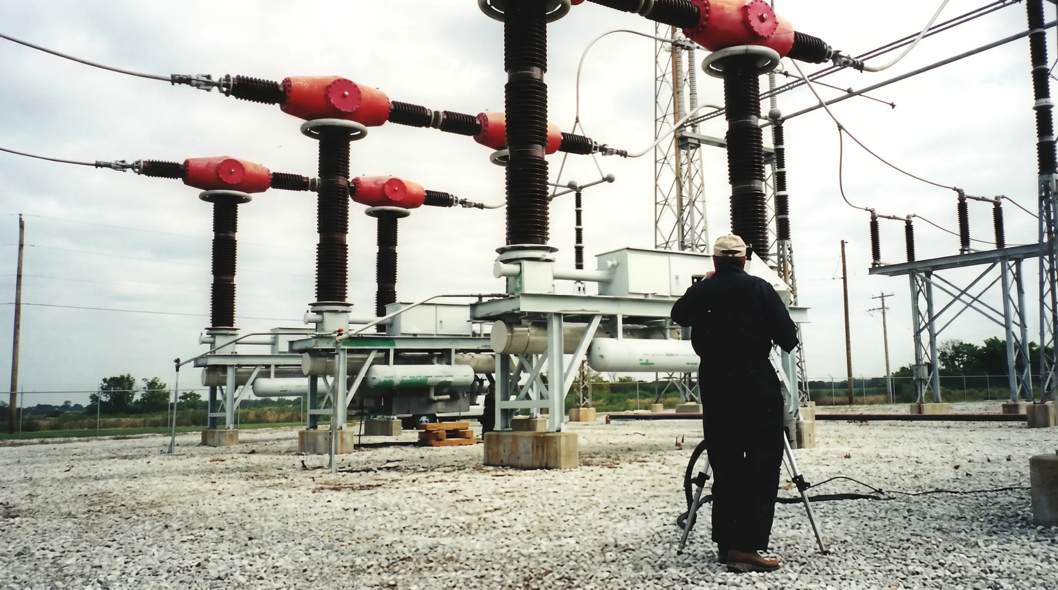 TDS technicians surveying substation transformer leaks for repair assessment