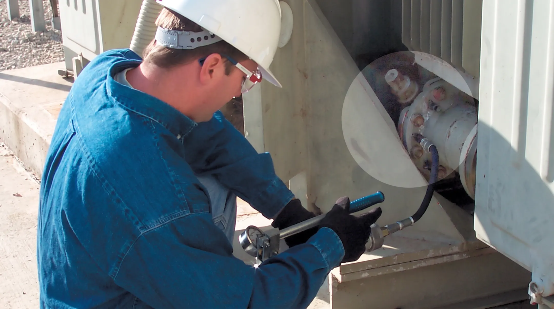 Technicians applying low pressure leak sealing to transformer gasket