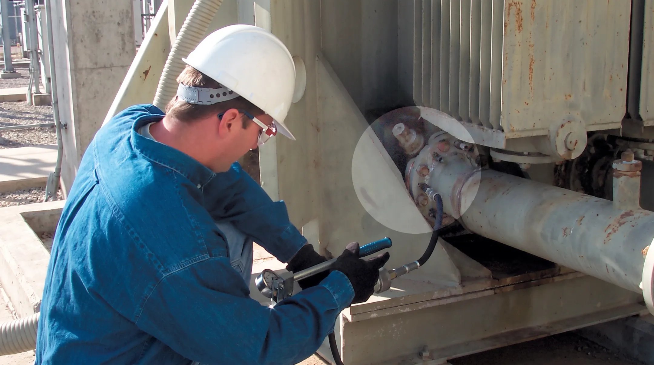 TDS technician applying specialized SF6 leak sealing at substation equipment