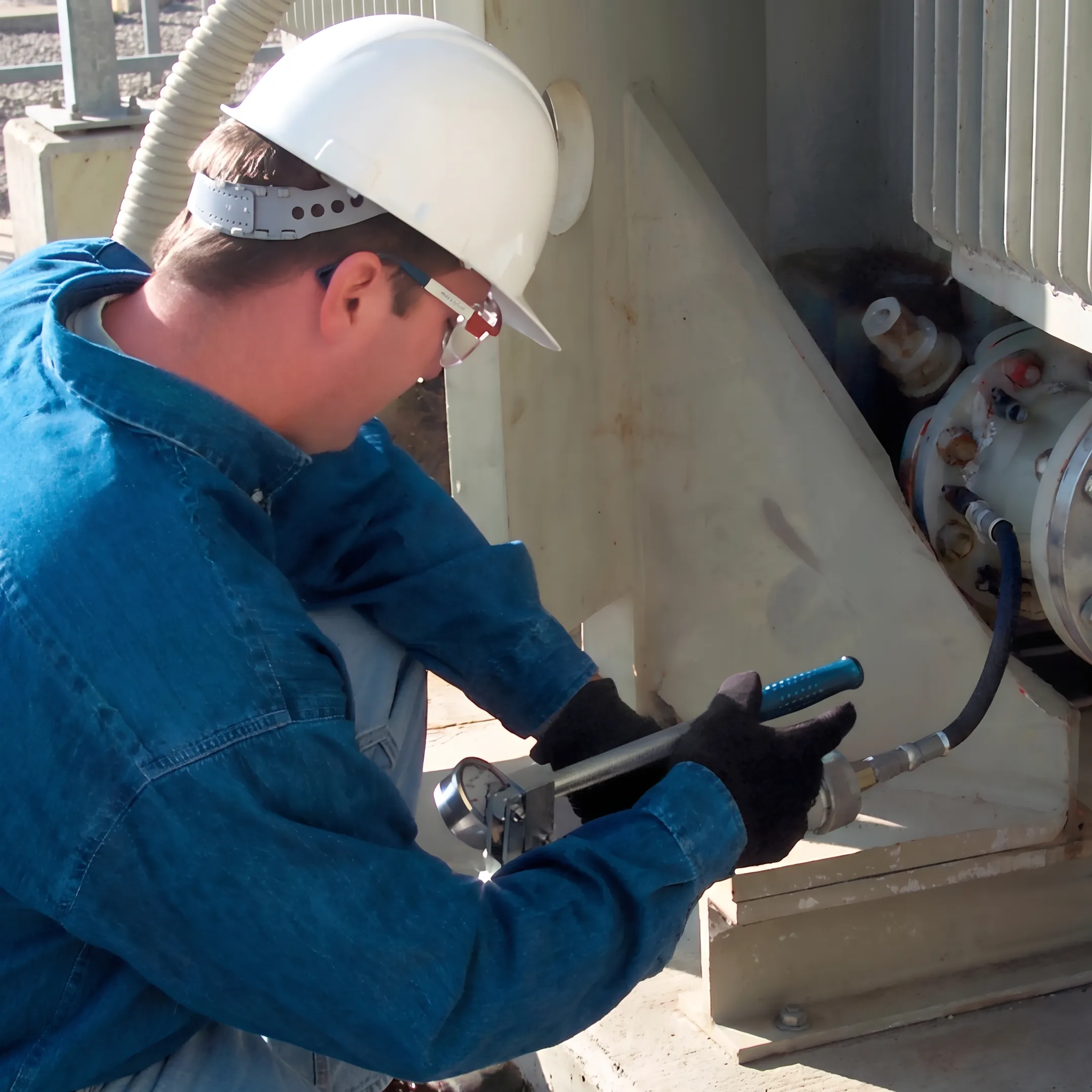 Specialist applying a targeted seal to an SF6 breaker flange connection