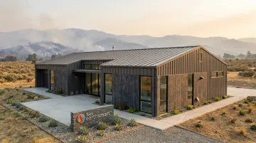 Fire-resistant WUI home construction using pre-insulated concrete masonry and non-combustible assemblies