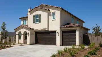 Fire-surviving home with stucco exterior walls and non-combustible cladding in wildfire zone