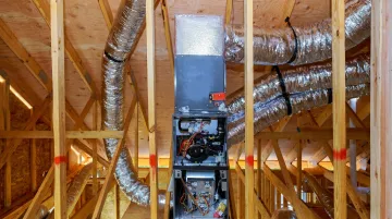 Residential HVAC system installation showing ductwork and mechanical equipment in home