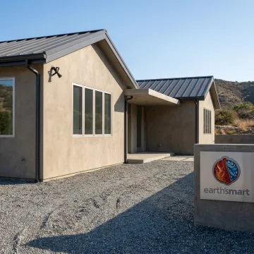 Fire-resilient modern home with integrated defense systems