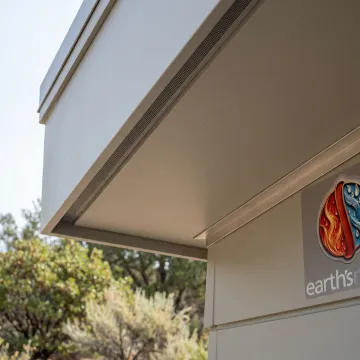 Fire rated soffit assembly under modern home eaves