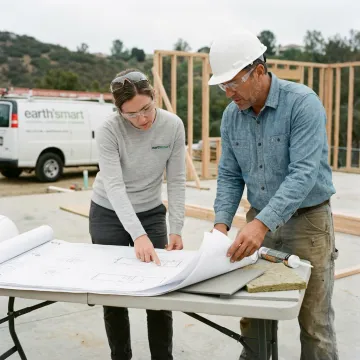 Architect reviewing resilient home plans