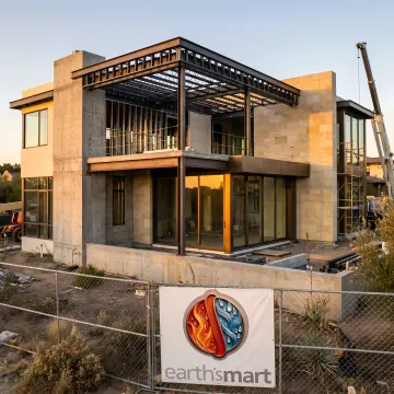 Architect coordinating residential construction plans