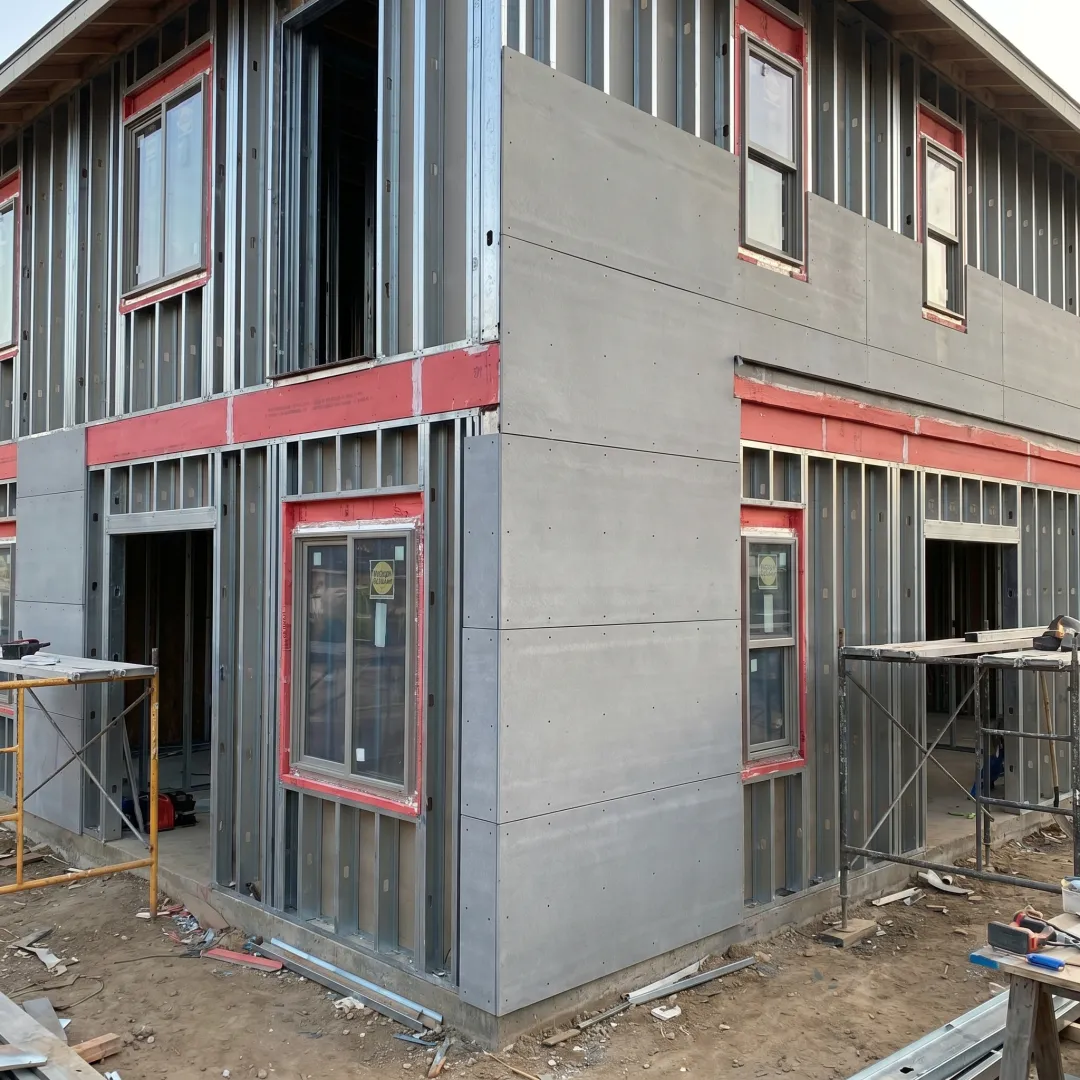 Fire-rated exterior wall cladding on a resilient home