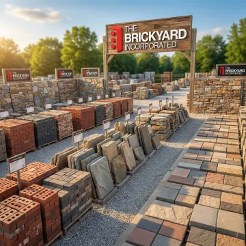 Wide selection of brick, stone, and paver materials displayed in a landscaping supply yard