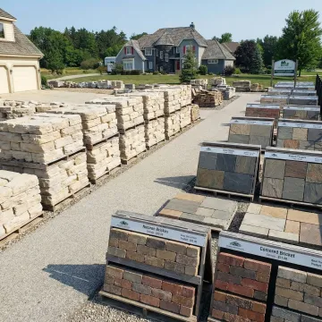 Variety of retaining wall blocks, pavers, and natural stone materials on display at The Brickyard