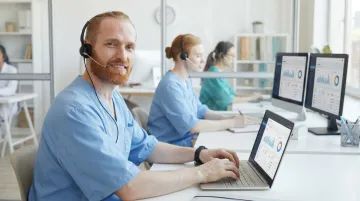 Healthcare contact center agents handling member services calls in modern facility