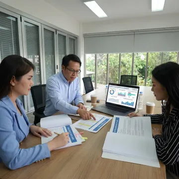 Consultants reviewing contact center outsourcing strategy