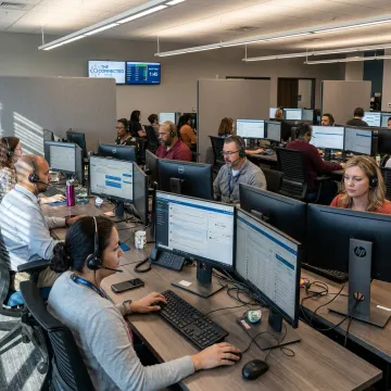 Outsourced contact center staff supporting customers
