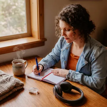 Woman journaling during a trauma recovery practice